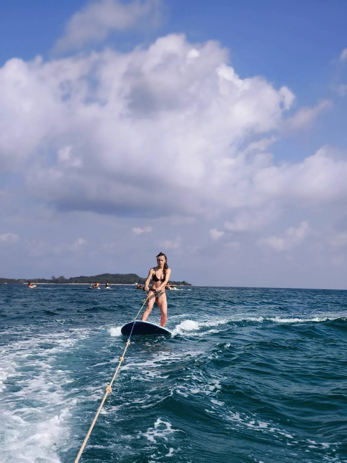 Guest wakeboarding behind a private boat charter near Koh Samui