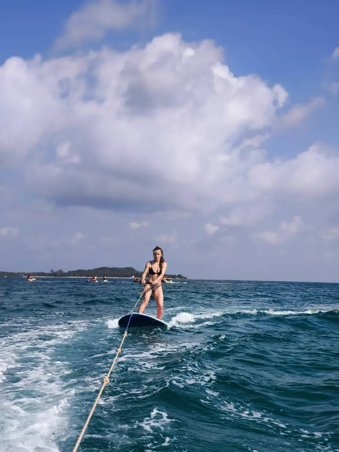 Guest wakeboarding behind a private boat charter near Koh Samui